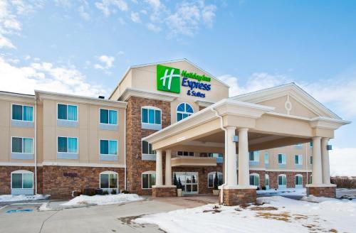 a hotel with a sign on the front of a building at Holiday Inn Express & Suites - Omaha I - 80 by IHG in Gretna