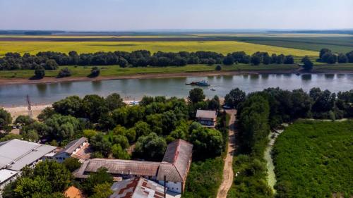 an aerial view of a river with a boat in it at Albatros in Călăraşi