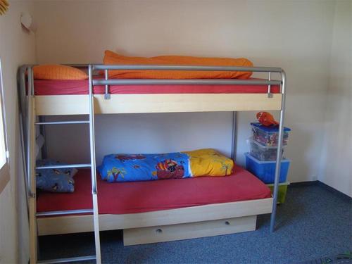 a bunk bed room with two bunk beds at Sot Spondas 15 in Savognin