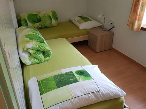 Postel nebo postele na pokoji v ubytování Tga Mucki