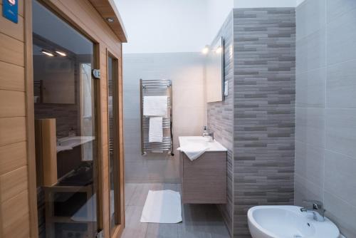 a bathroom with a sink and a toilet at BudapestEasyFlat Basilica Lux in Budapest
