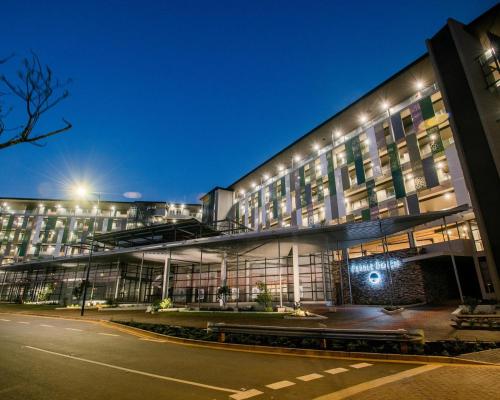 a lit up building with a street in front of it at No 2 Heleza Blvd Sibaya, Oceandune, Umhlanga Durban in Umdloti