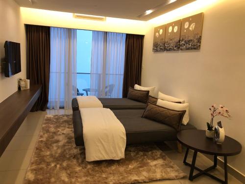 a living room with a couch and a table at Sky D'Mont Suites in Genting Highlands