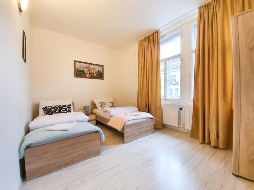 Cama o camas de una habitación en KK Apartments