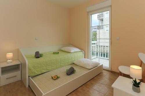 Un pat sau paturi într-o cameră la Villa Marijana