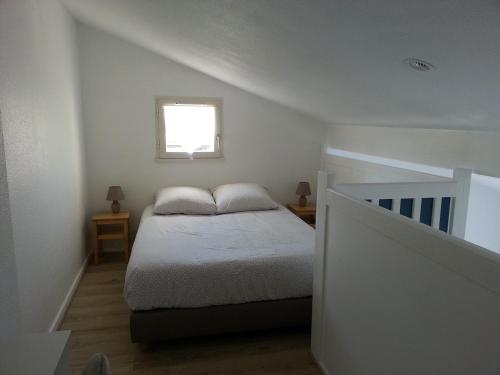 En eller flere senge i et værelse på Maison proche Golf plage et piscine à Pornic