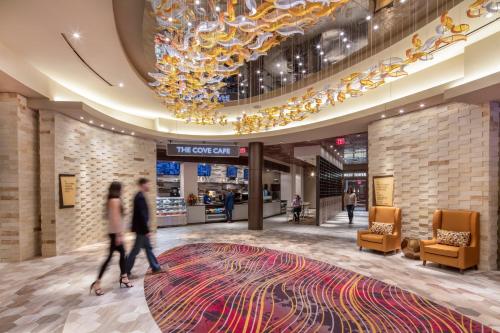 people walking through the lobby of a shopping mall at Choctaw Casino Hotel - Grant in Grant
