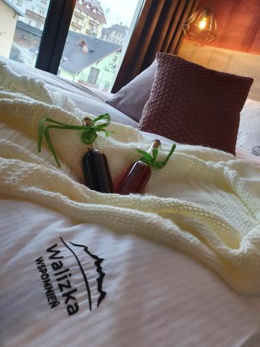 a close up of a bed with some food on it at Walizka Wspomnień in Karpacz