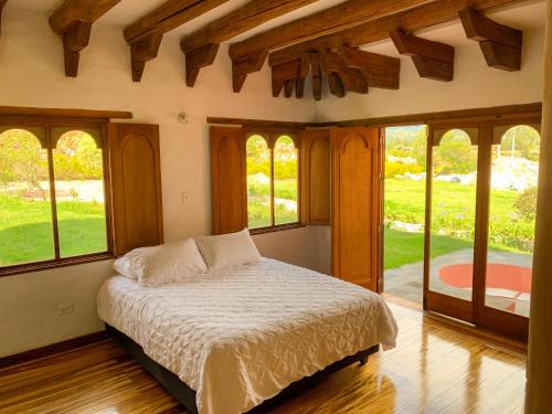 Ein Bett oder Betten in einem Zimmer der Unterkunft Hotel 1572 El Origen