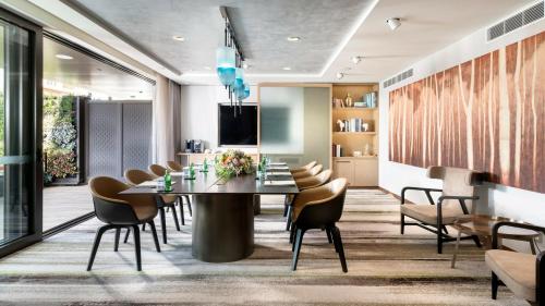 a dining room with a table and chairs at InterContinental Perth City Centre by IHG in Perth