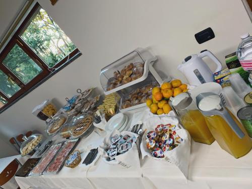 a white table with a bunch of food on it at Hotel Due Pini Conte in Angri