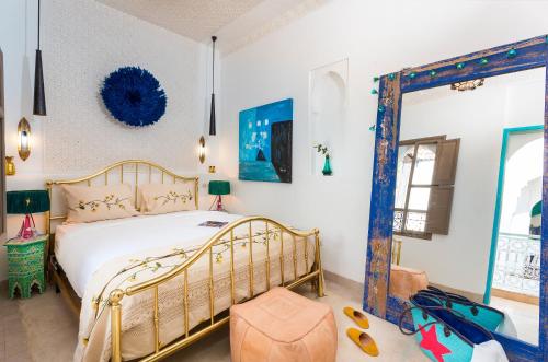 Postel nebo postele na pokoji v ubytování Riad Lumière