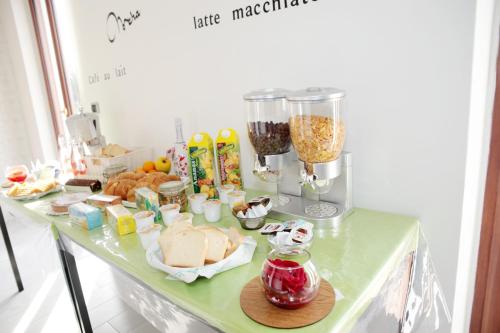 a table with a counter with food and a blender at B&B Magma in Ercolano