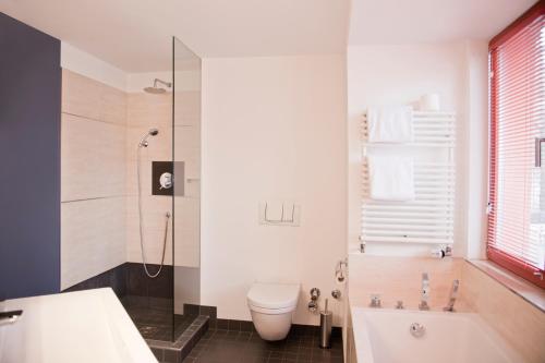 Un baño de Hotel Adele am Alex
