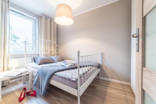 Ένα ή περισσότερα κρεβάτια σε δωμάτιο στο Apartament Graniczna 6