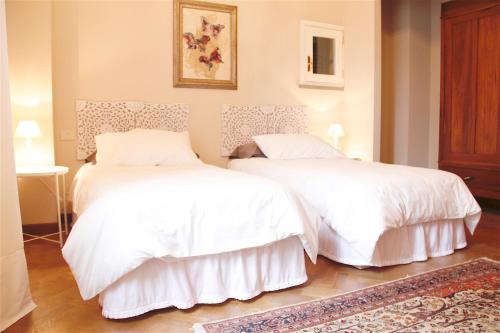 A bed or beds in a room at Art Apartment Villa Mannelli