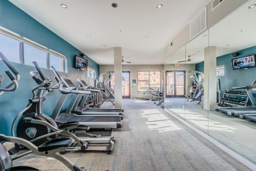 a gym with treadmills and cardio machines at Regal Stays Corporate Apartments - McKinney Ave - Uptown Dallas in Dallas