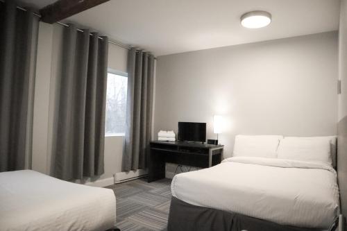 Katil atau katil-katil dalam bilik di Auberge Valcartier