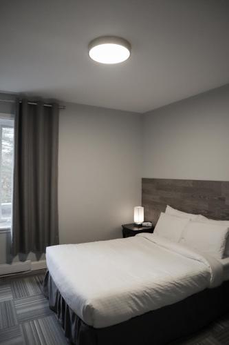 Katil atau katil-katil dalam bilik di Auberge Valcartier