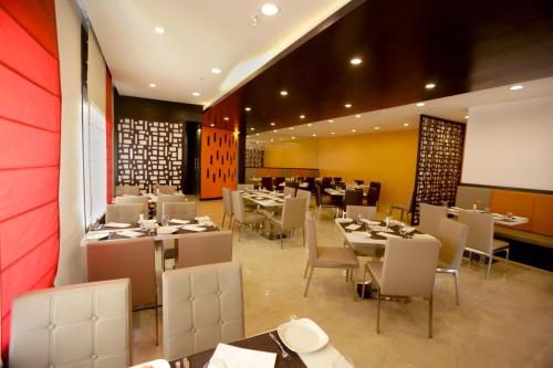 Restauracja lub miejsce do jedzenia w obiekcie Astoria Hotels Madurai