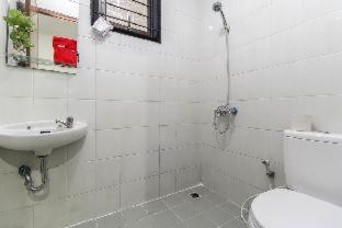 a white bathroom with a sink and a toilet at RedDoorz Plus near Trisakti University in Jakarta