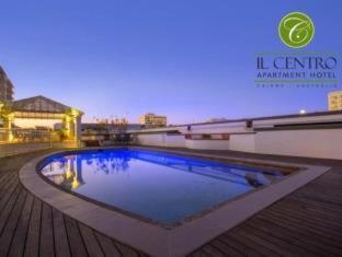 a swimming pool on top of a building at Il Centro Apartment Hotel in Cairns