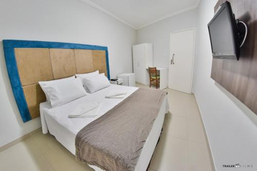 Tempat tidur dalam kamar di Primme Hotel Aracaju