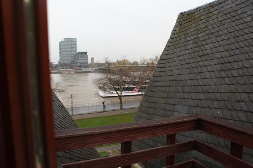 a view of a river from a balcony at Haus Enteresan in Cologne