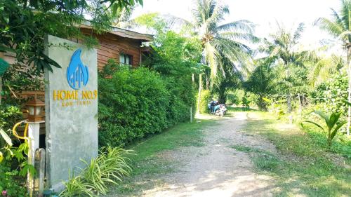 a house with a sign that reads have no our money at Home No.9 in Ko Lanta