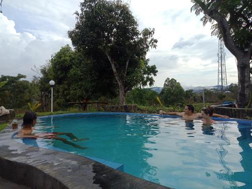 a group of people in a swimming pool at Kintamani Cabins in Kintamani