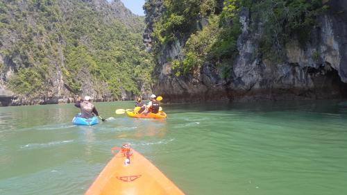 a group of people on kayaks in a river at Home No.9 in Ko Lanta