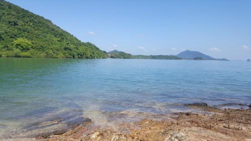 a large body of water with mountains in the background at Home No.9 in Ko Lanta