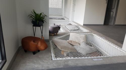 a metal bed with pillows on it in a room at Loyy Hotel in Chiang Mai