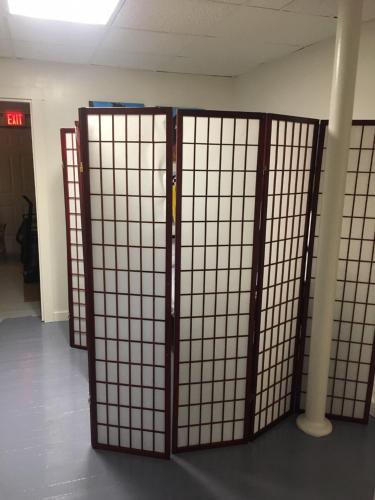 a pair of doors in a room with a wall at Art Gallery Hostel in Whitefield