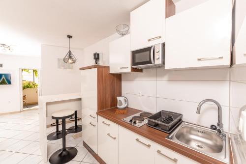Eldhús eða eldhúskrókur á Apartments Mate