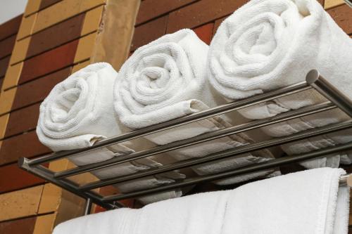 a statue of a towel rack on the side of a building at Sasha Transit Hotel in Katunayake