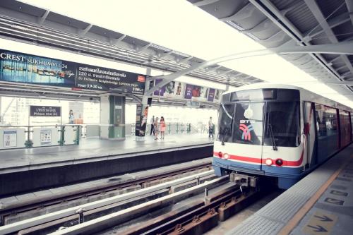 a subway train pulling into a subway station at Arcadia Suites Bangkok in Bangkok