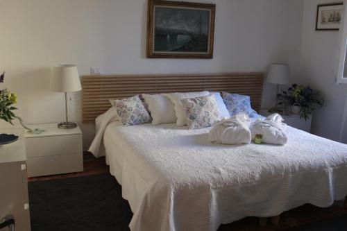 a bedroom with a bed with towels on it at San Polo Near Rialto Fish Market in Venice