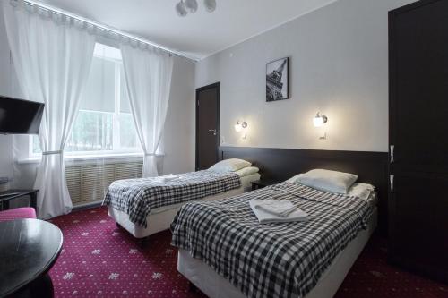 Кровать или кровати в номере Транзит Отель 