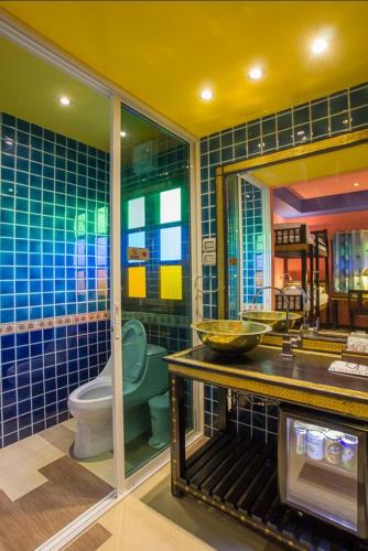 a bathroom with a toilet and a sink at Changpuak Boutique House in Chiang Mai