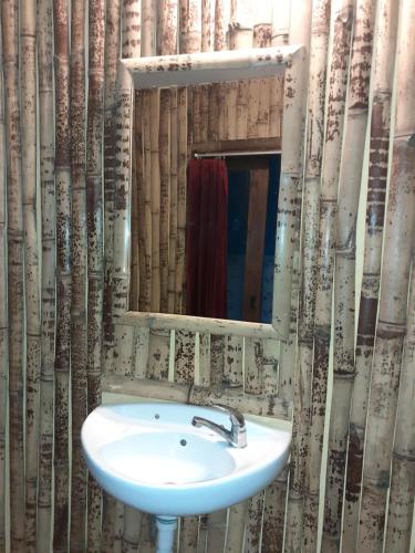 a bathroom with a sink and a mirror at Club Resort MATAHARI in Gili Trawangan