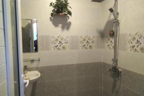 a bathroom with a sink and a toilet at Luan'S Villa in Da Lat