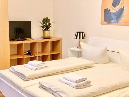 Tempat tidur dalam kamar di Hotel Arena Rooms - Berlin Mitte