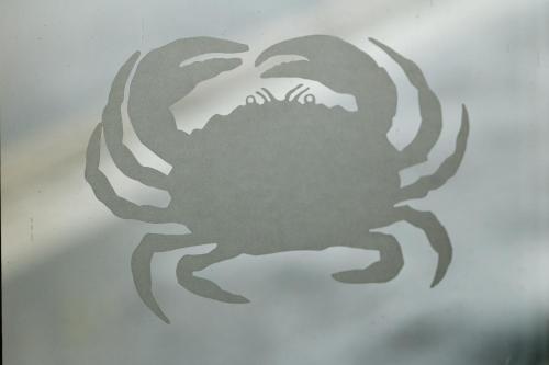 a stencil of a crab on a wall at Hotell Krabban in Strömstad