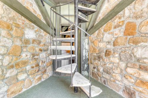 a metal spiral staircase in a brick wall at Slopesider 01 in Sugar Mountain
