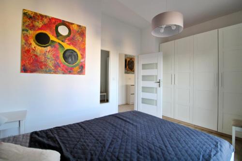 Posteľ alebo postele v izbe v ubytovaní Kościuszki 130 C TectumApartments