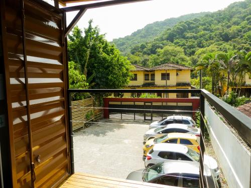 a group of cars parked in a row on a balcony at Praia Camburi - Studios Kuta in Camburi