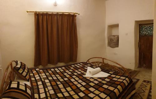 Кровать или кровати в номере The Orient Home