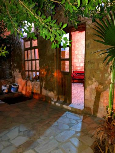an open door to a room with a patio at The Orient Home in Wadi Musa