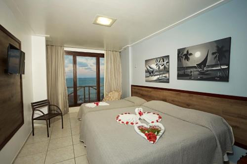 Katil atau katil-katil dalam bilik di Moriah Natal Beach Hotel